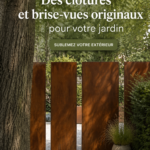 Clôtures modernes et brise-vues colorés dans un jardin bien entretenu.